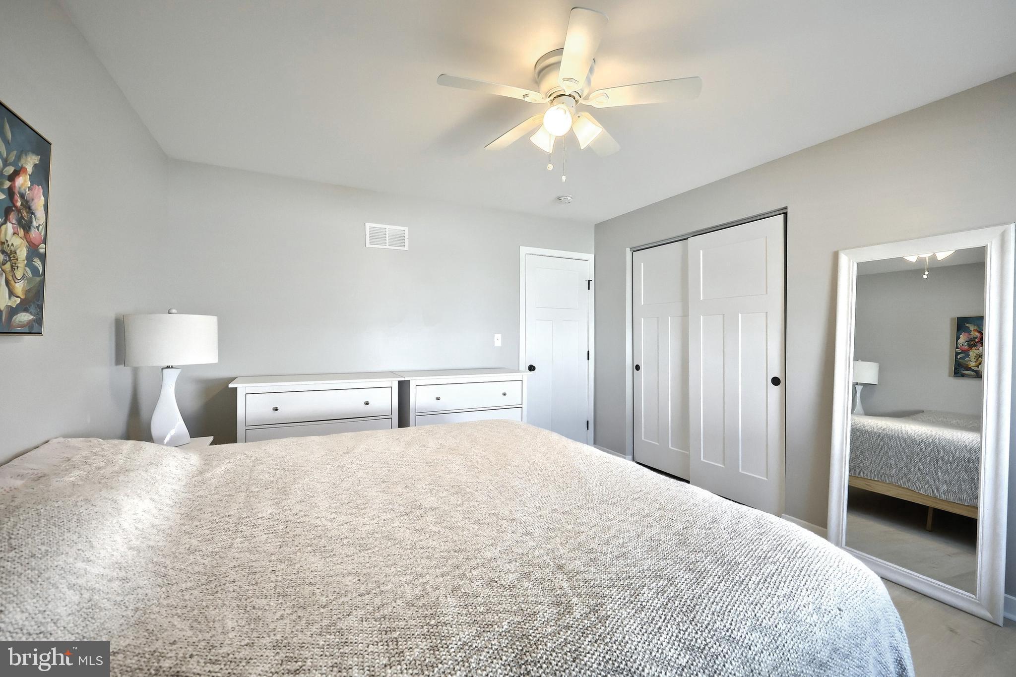 55 Cardinal Drive Hanover, PA 17331 - Photo 33 of 53 a bedroom with a large bed and a chandelier