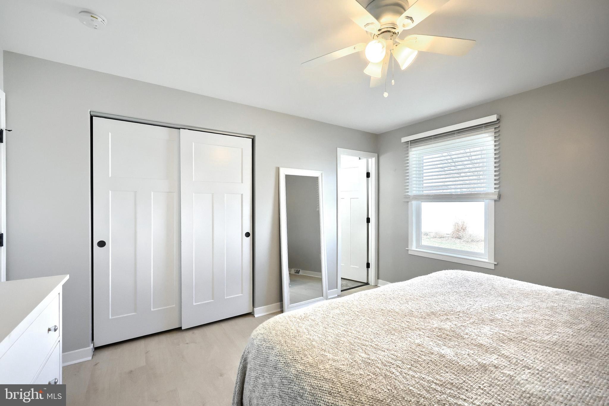 55 Cardinal Drive Hanover, PA 17331 - Photo 34 of 53 a spacious bedroom with a bed and a chandelier