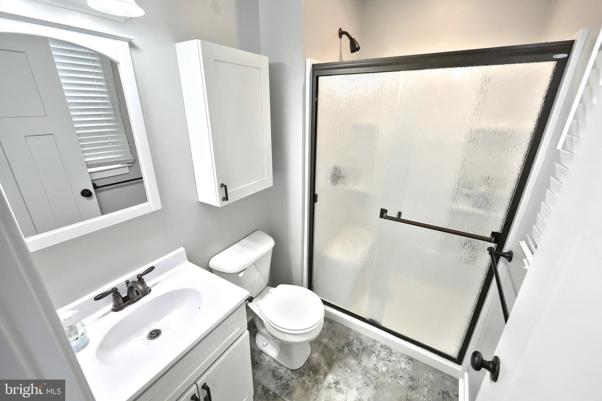 55 Cardinal Drive Hanover, PA 17331 - Photo 35 of 53 a bathroom with a sink mirror vanity and toilet