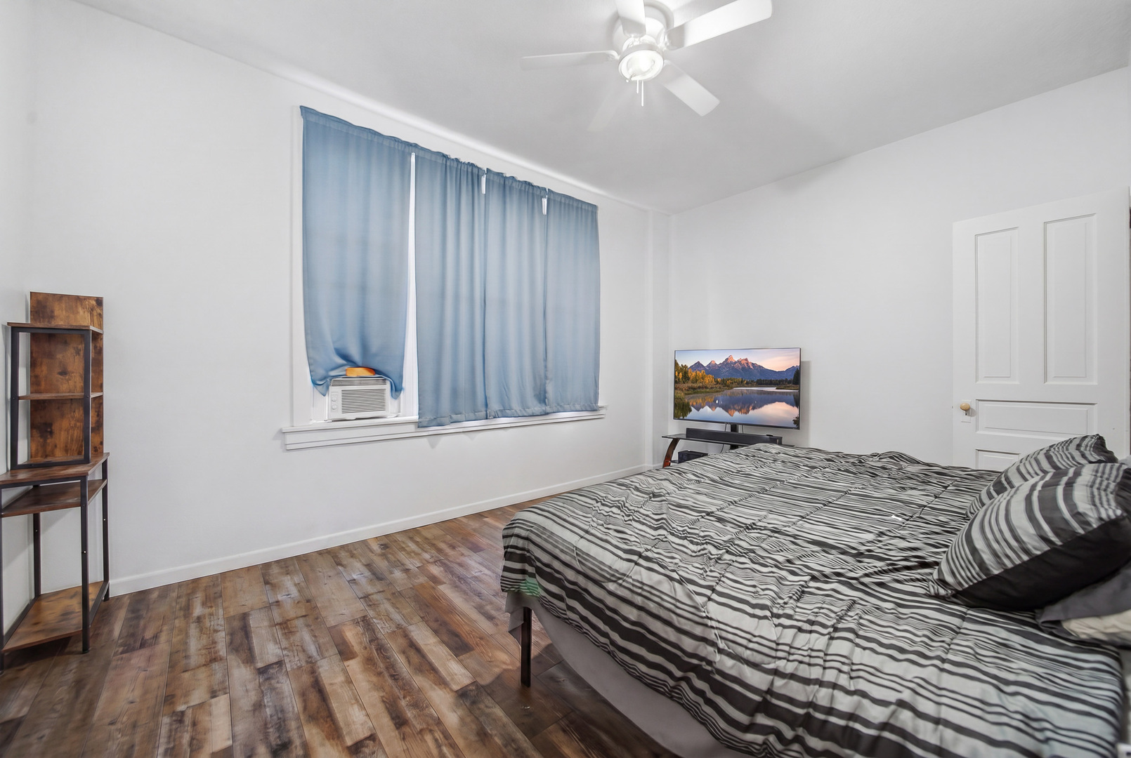 305 Monroe Avenue Dixon, IL 61021 - Photo 23 of 36 a bedroom with a bed and wooden floor
