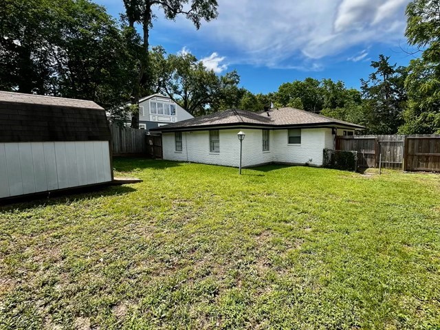 1409 20th Street Huntsville, TX 77340 - Photo 3 of 13 a view of a house with a yard