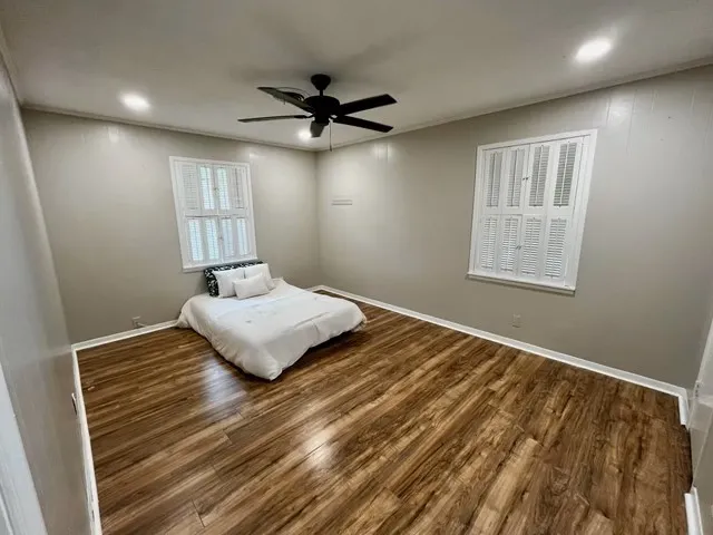 a bedroom with a bed and window