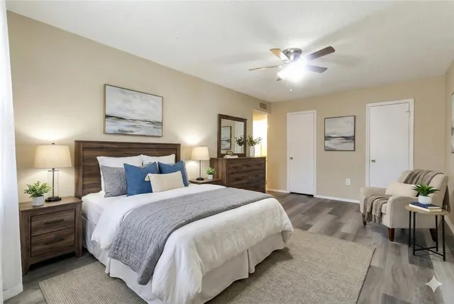 a spacious bedroom with a bed and closet