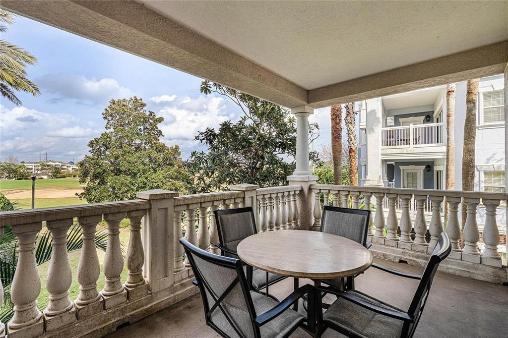 1102 Sunset View Circle, Unit 204 Reunion, FL 34747 - Photo 18 of 26 a view of a balcony with furniture