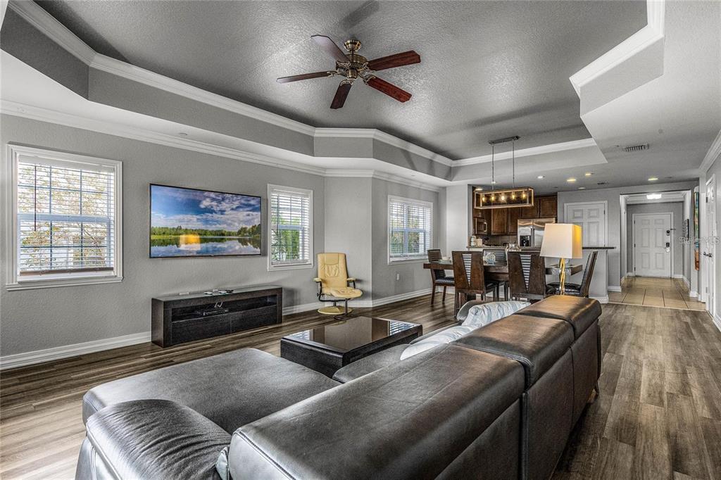 1102 Sunset View Circle, Unit 204 Reunion, FL 34747 - Photo 4 of 26 a living room with furniture and a flat screen tv