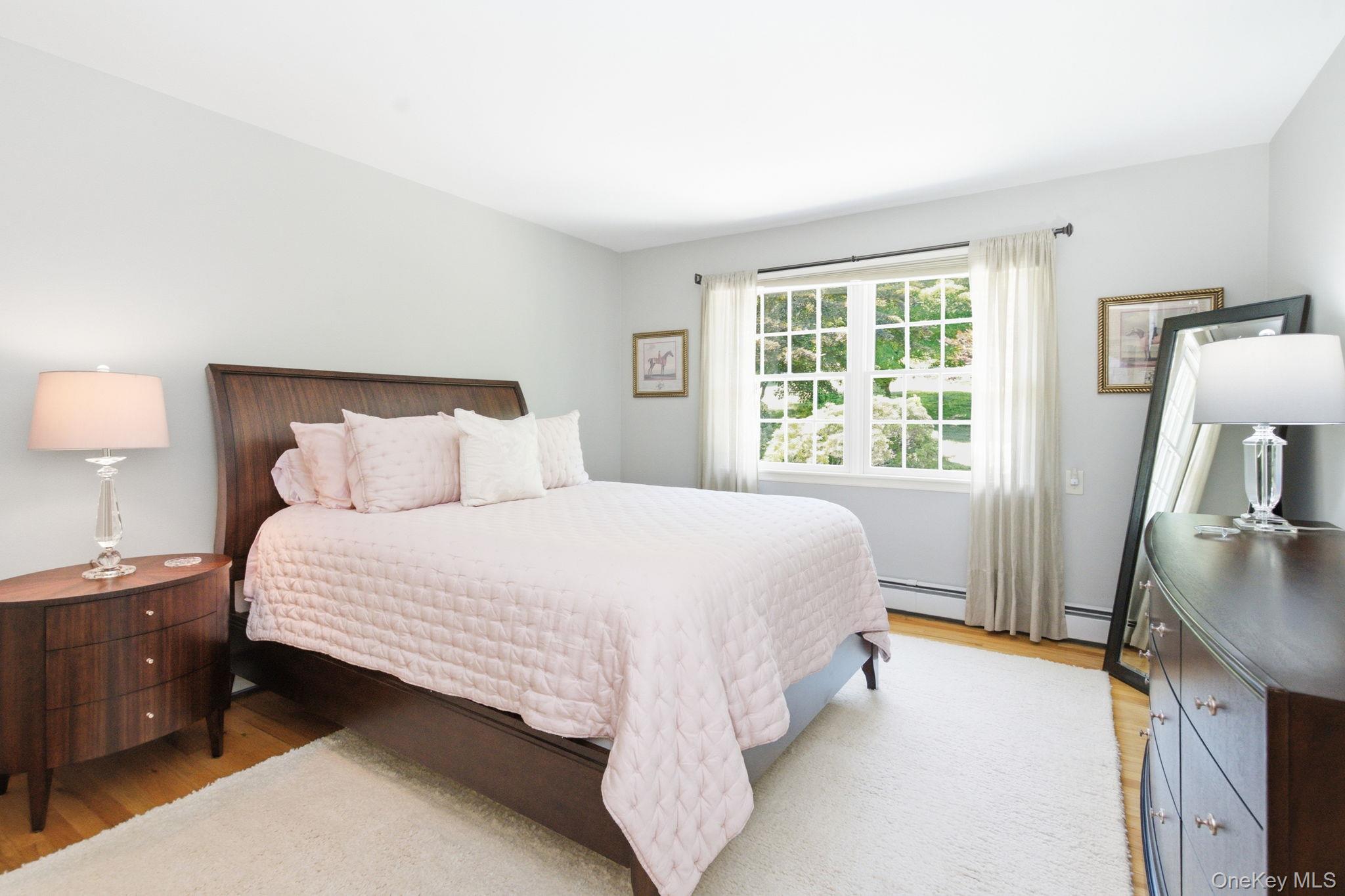 32 Bedell Road Katonah, NY 10536 - Photo 21 of 49 Oversized windows bring garden outlooks into this bright bedroom.
