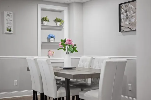 a workspace with furniture and kitchen view