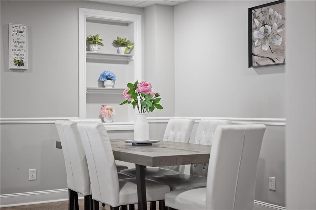 144 Bigham Street Pittsburgh, PA 15211 - Photo 13 of 45 a dining room with furniture and wooden floor
