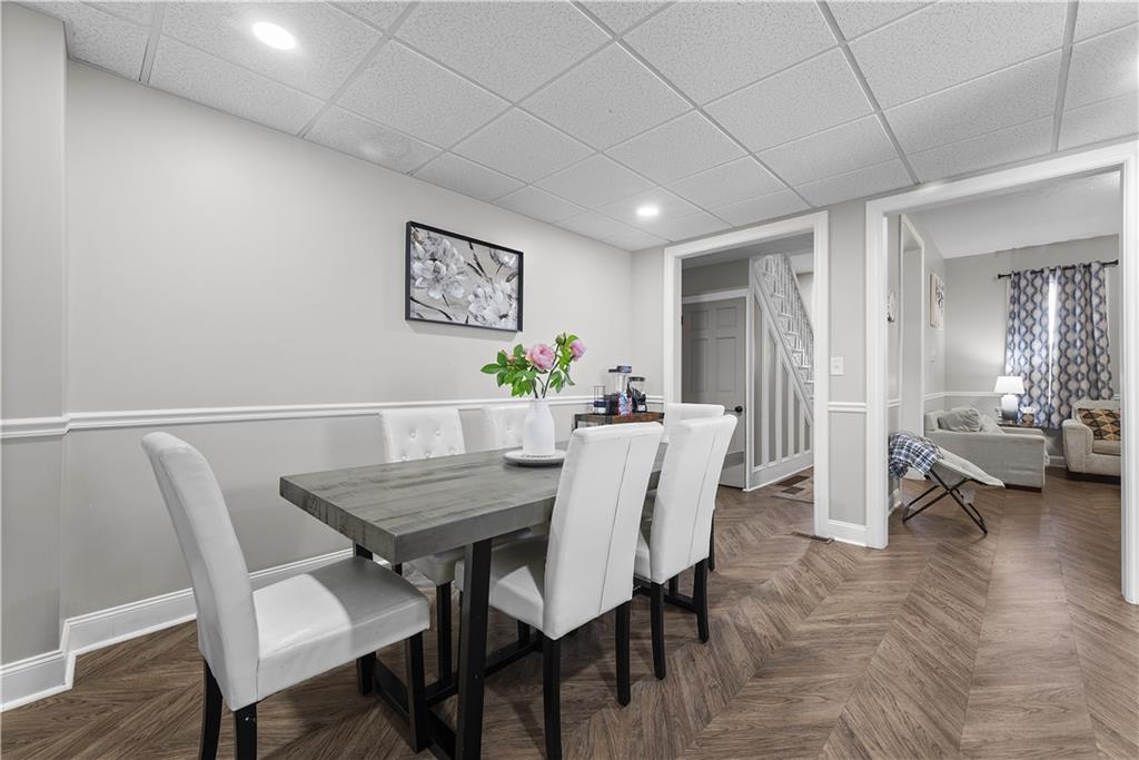 144 Bigham Street Pittsburgh, PA 15211 - Photo 15 of 45 a view of a dining room with furniture and wooden floor