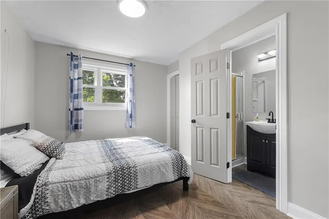 a bedroom with a bed and a closet