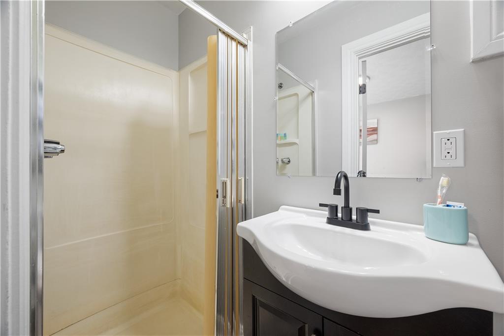 144 Bigham Street Pittsburgh, PA 15211 - Photo 24 of 45 a bathroom with a sink and a mirror