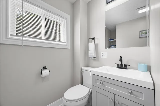 a bedroom with bed and a window