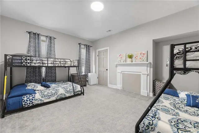 a bedroom with furniture and a chandelier