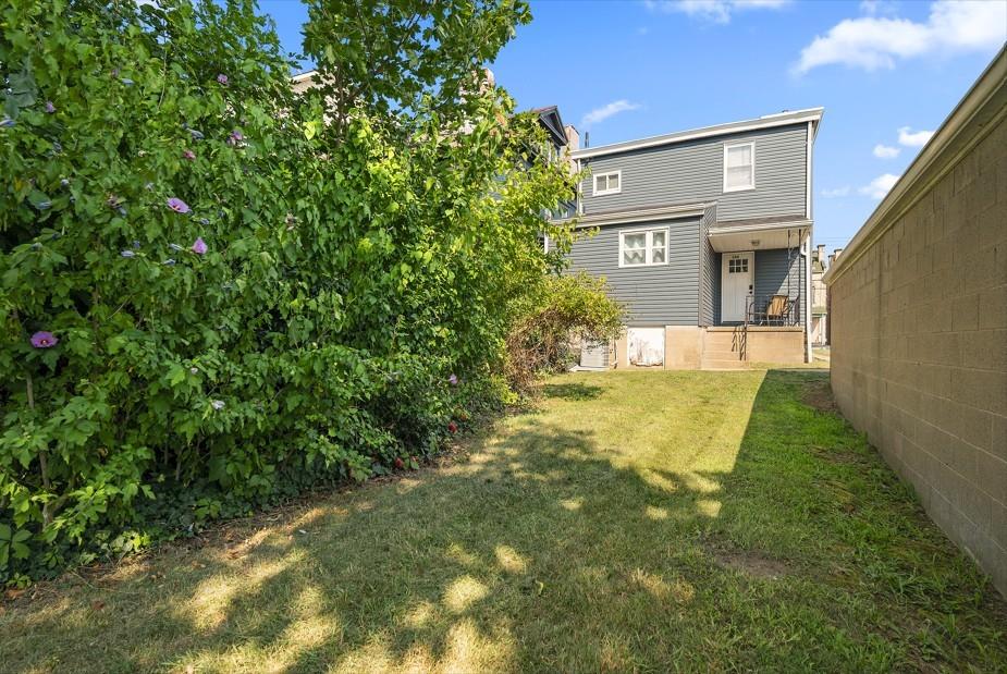 144 Bigham Street Pittsburgh, PA 15211 - Photo 38 of 45 a view of a large tree in front of a brick house
