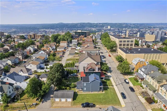 an aerial view of a city with lots of residential buildings