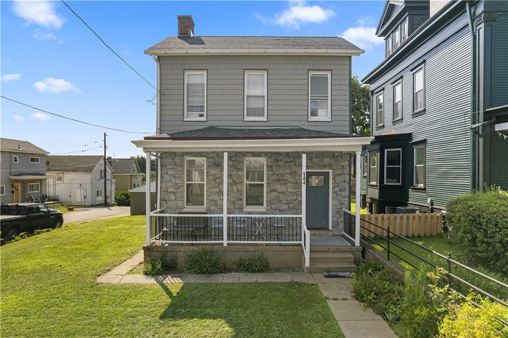 144 Bigham Street Pittsburgh, PA 15211 - Photo 45 of 45 a front view of a house with a yard