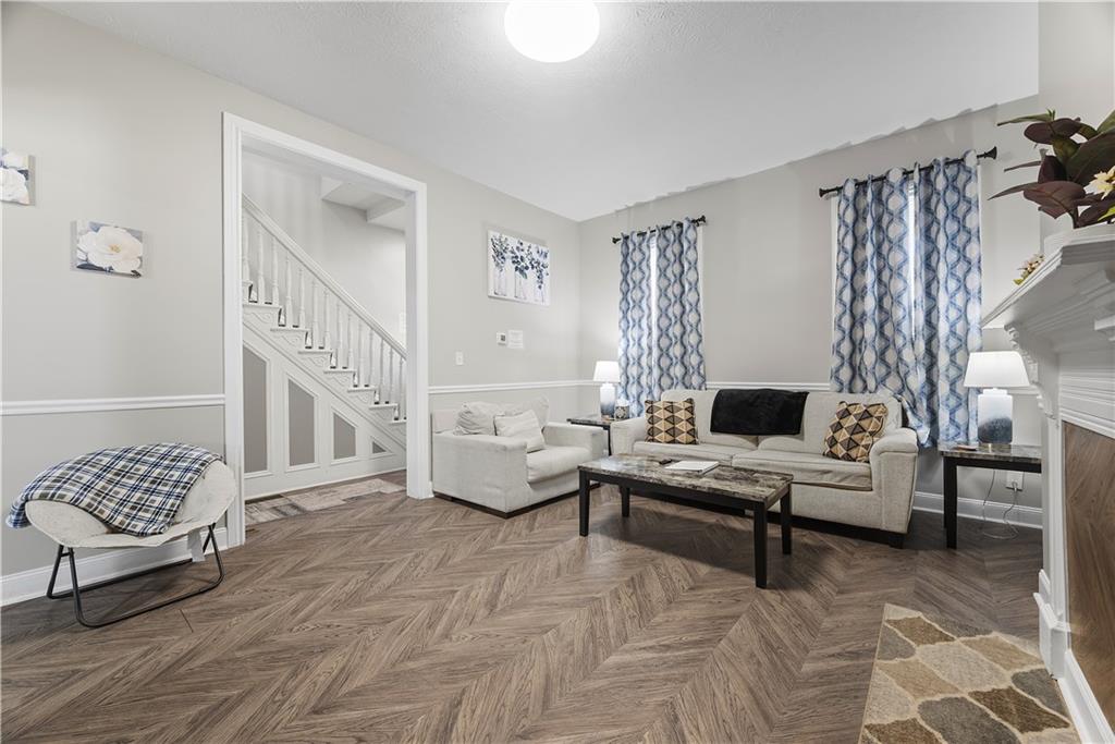 144 Bigham Street Pittsburgh, PA 15211 - Photo 10 of 45 a living room with furniture and a window