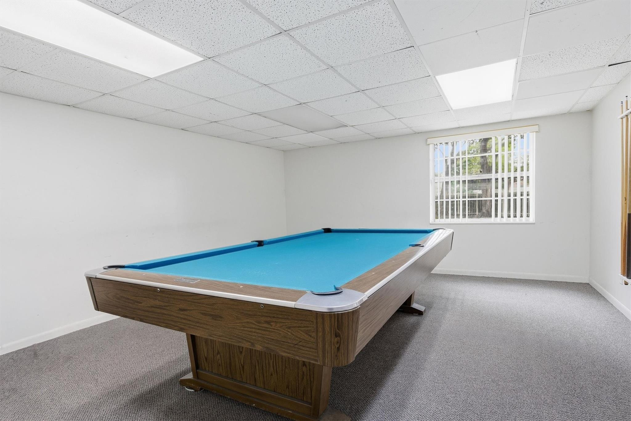 3910 Inverrary Boulevard, Unit 708B Lauderhill, FL 33319 - Photo 38 of 58 a room with pool table and windows
