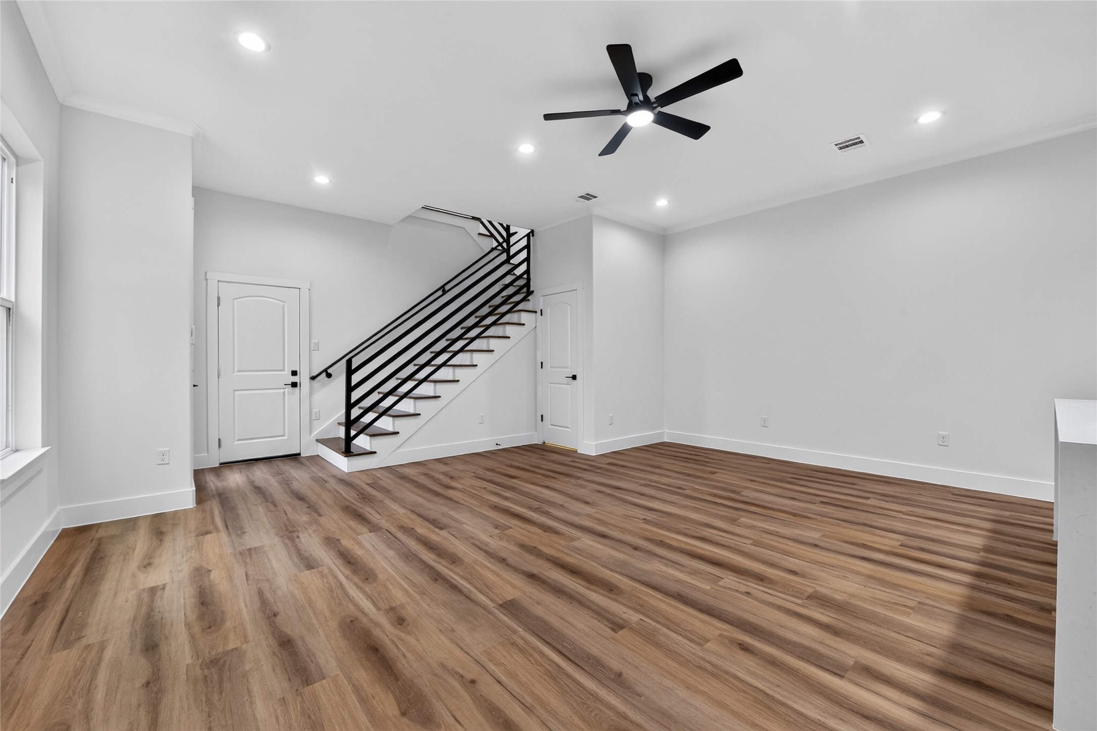 3537 Amos Street Houston, TX 77021 - Photo 12 of 32 Thoughtfully designed--convenient garage entry opens directly into the living spaces, while steps to the side lead upstairs to the bedrooms and baths.