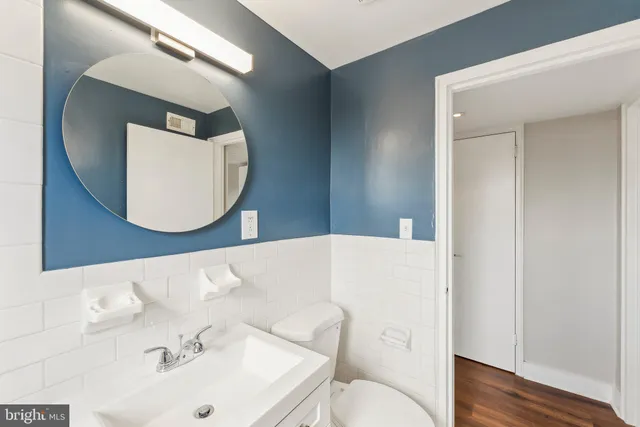 a bathroom with a sink and mirror