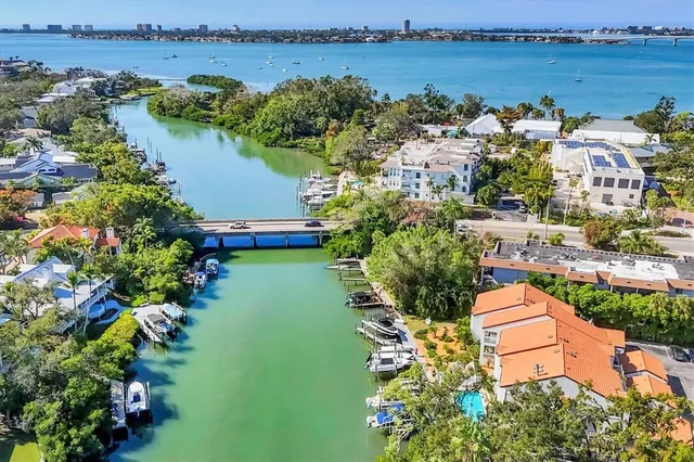 an aerial view of a city with ocean view