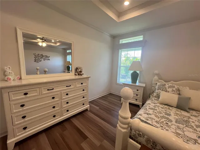 a bedroom with a bed and a dresser