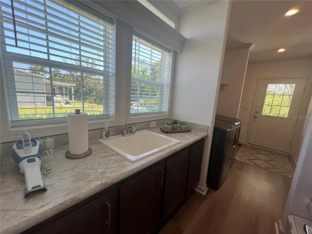 a kitchen with sink and window