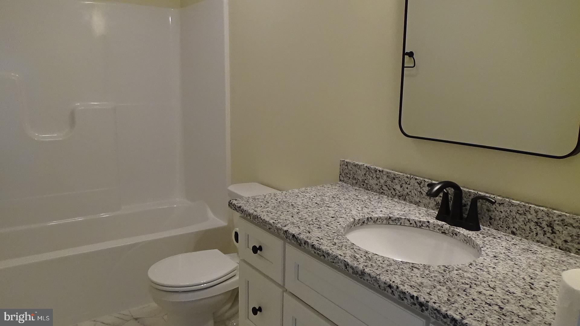 130 Soule Road New Bloomfield, PA 17068 - Photo 14 of 23 a bathroom with a granite countertop sink toilet and shower