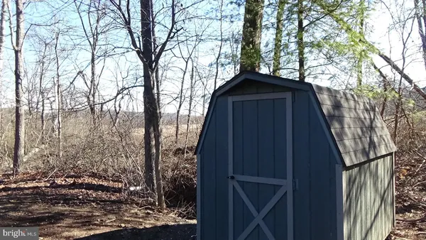 a view of a wooden door in the backyard