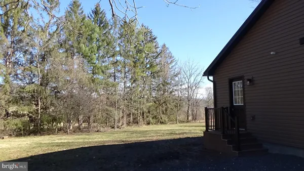 a view of a yard with an outdoor space