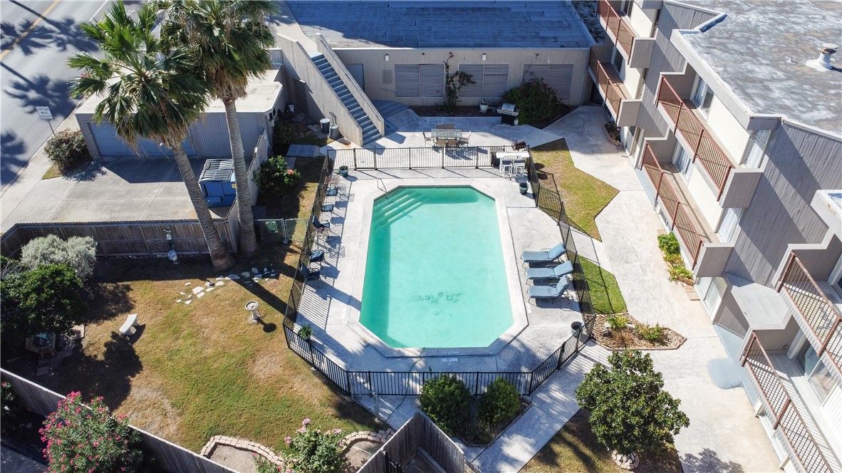 520 South Chaparral Street, Unit 204 Corpus Christi, TX 78401 - Photo 20 of 24 an aerial view of a house with a swimming pool
