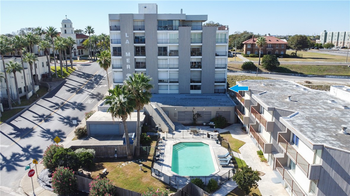 520 South Chaparral Street, Unit 204 Corpus Christi, TX 78401 - Photo 3 of 24 a couple of cars parked in front of building