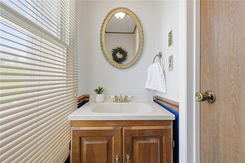 307 Hamlet Court Pittsburgh, PA 15227 - Photo 19 of 43 a bathroom with a sink and a mirror