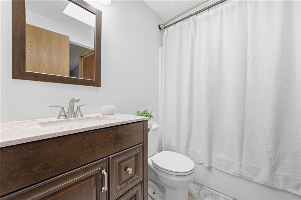 307 Hamlet Court Pittsburgh, PA 15227 - Photo 23 of 43 a bathroom with a sink a toilet and a mirror