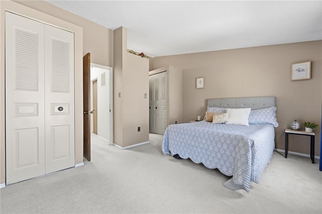 307 Hamlet Court Pittsburgh, PA 15227 - Photo 25 of 43 a bedroom with a bed and a night stand