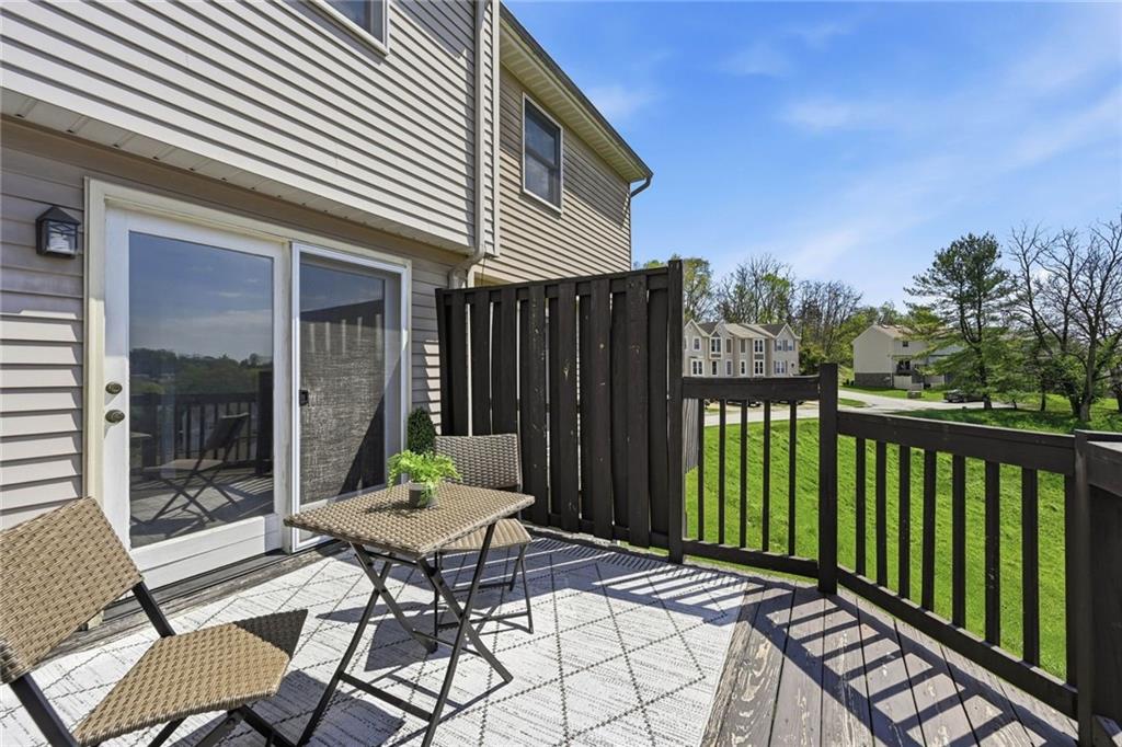 307 Hamlet Court Pittsburgh, PA 15227 - Photo 32 of 43 a view of a patio with table and chairs with wooden floor and fence