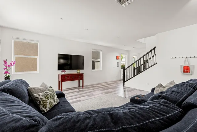 a kitchen with stainless steel appliances a stove a sink and a microwave