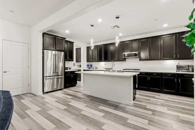 a kitchen with a stove and a sink