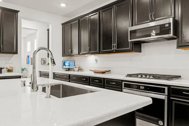 a kitchen with a stove and a sink
