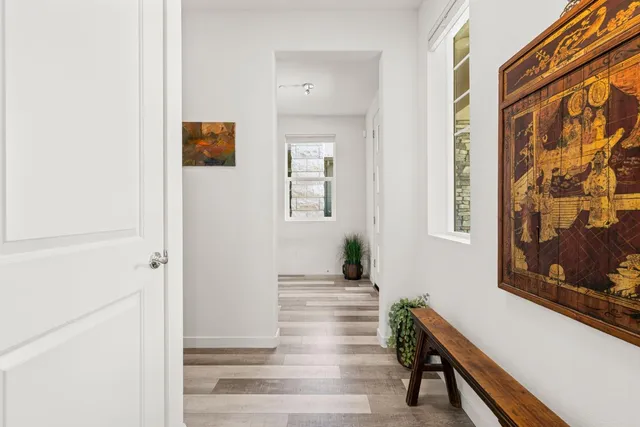 a bedroom with a bed and a table