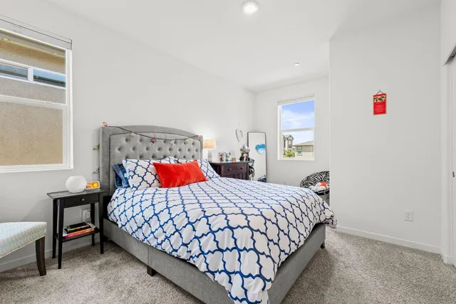a spacious bathroom with a tub sink shower and mirror