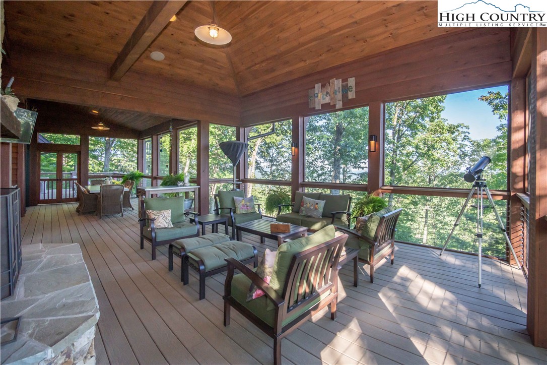 4480 Reynolds Parkway Boone, NC 28607 - Photo 7 of 44 a living room with large windows and wooden floor