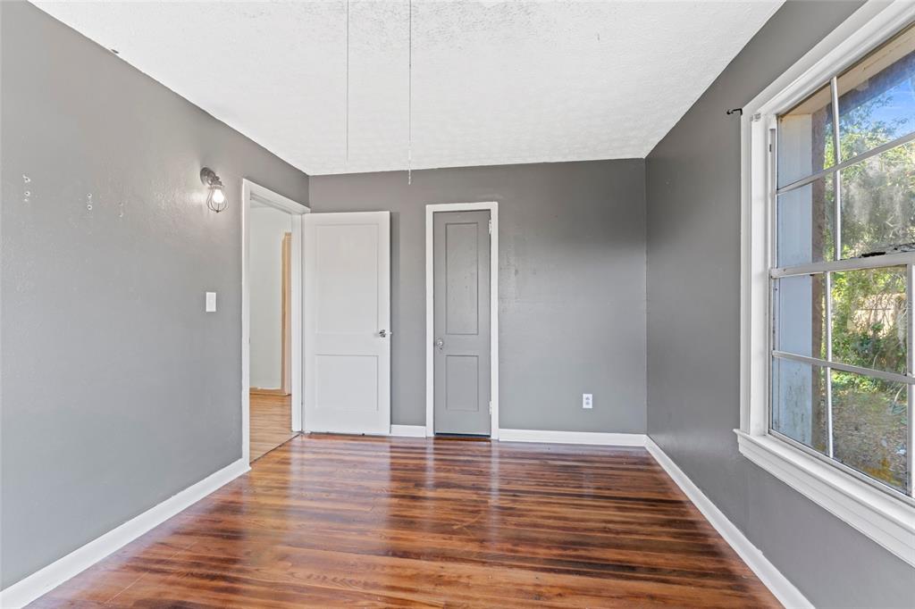 11680 Aaron Road Jacksonville, FL 32218 - Photo 16 of 26 a view of room with window and wooden floor