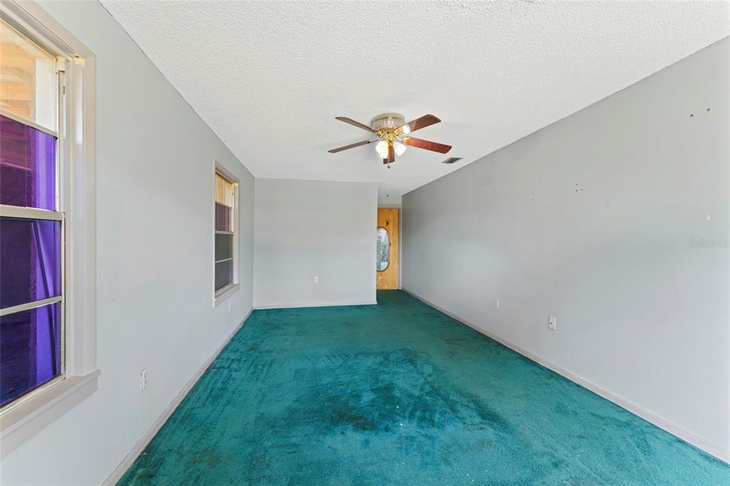 11680 Aaron Road Jacksonville, FL 32218 - Photo 20 of 26 a view of a big room with closet and a window