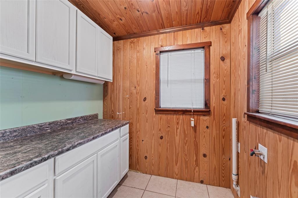 11680 Aaron Road Jacksonville, FL 32218 - Photo 22 of 26 a kitchen with granite countertop white cabinets and a wooden floor