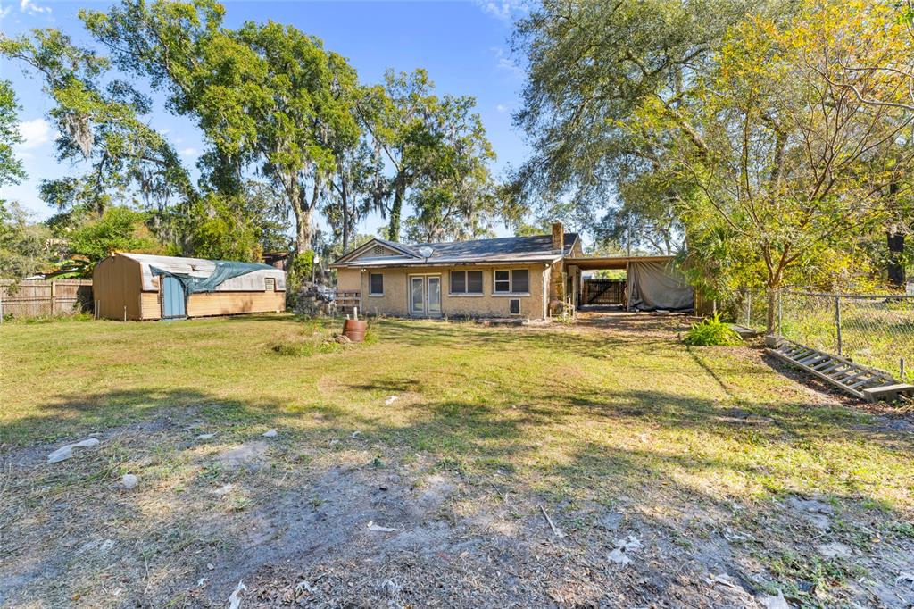 11680 Aaron Road Jacksonville, FL 32218 - Photo 25 of 26 a view of a house with swimming pool and sitting area