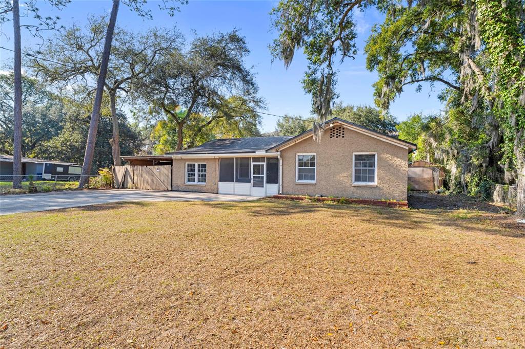 11680 Aaron Road Jacksonville, FL 32218 - Photo 3 of 26 a house with trees in the background