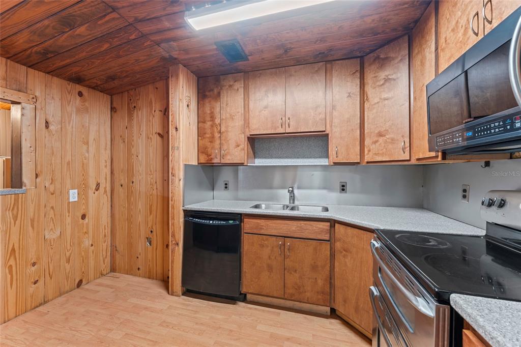 11680 Aaron Road Jacksonville, FL 32218 - Photo 8 of 26 a kitchen with stainless steel appliances granite countertop a sink stove and refrigerator