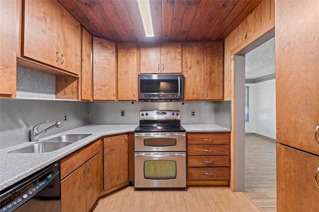 11680 Aaron Road Jacksonville, FL 32218 - Photo 9 of 26 a kitchen with appliances a sink and a stove