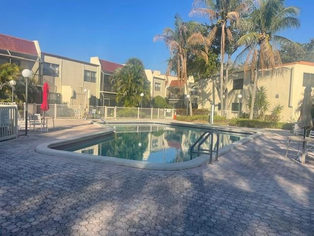 301 North Pine Island Road, Unit 110 Plantation, FL 33324 - Photo 11 of 13 a view of outdoor space with swimming pool
